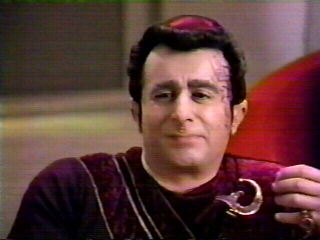 Kivas Fajio - Zibalian trader and collecter - Saul Rubinek